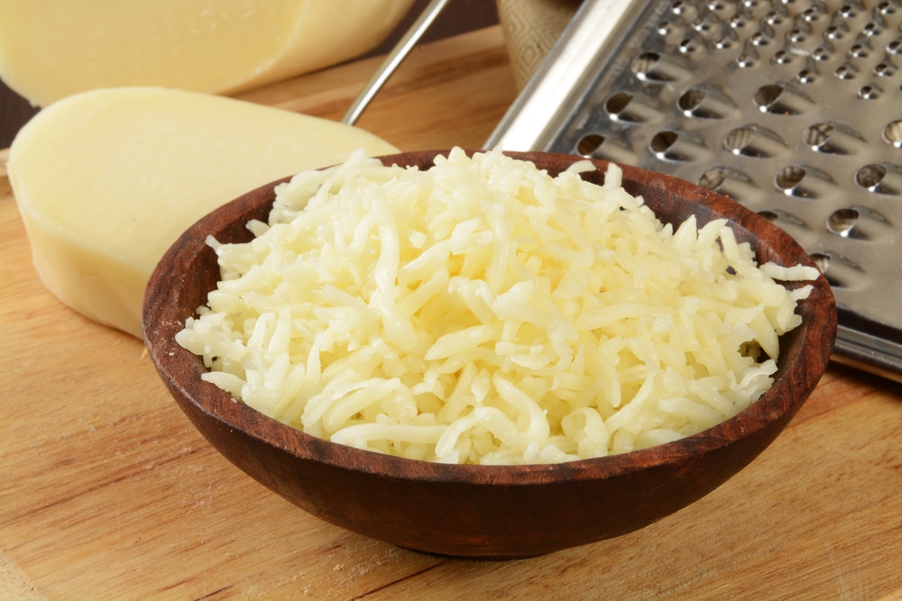 A bowl of Grated mozzarella cheese